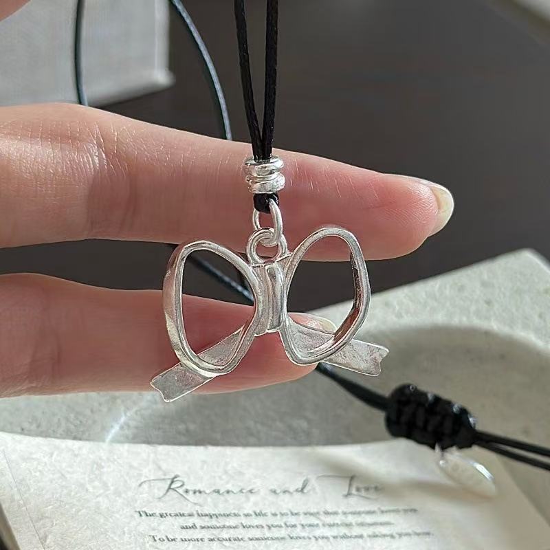 Wholesale 925 Sterling Silver Hollow Bow Pendant Necklace with Black Leather Cord - Image 2